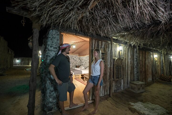 Experience the magic of a desert night where cozy accommodations and starry skies invite exploration and connection in the heart of the UAE’s stunning wilderness.